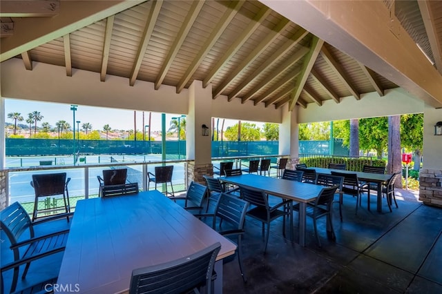 view of patio / terrace featuring fence and outdoor dining area
