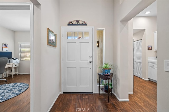 entrance foyer with baseboards, recessed lighting, and dark wood-type flooring
