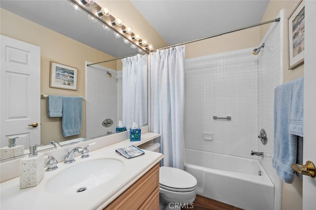 bathroom with vanity, toilet, and shower / tub combo