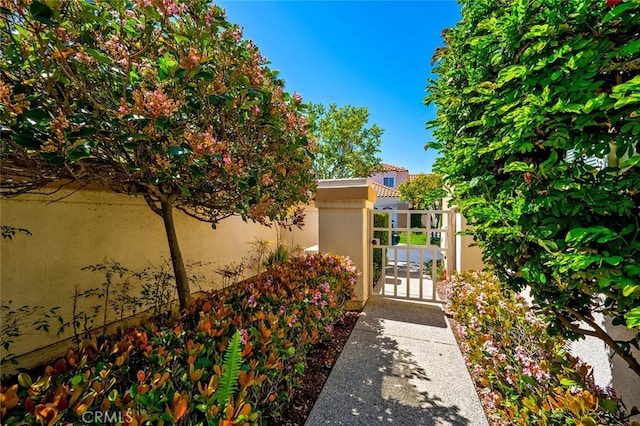 view of gate featuring fence