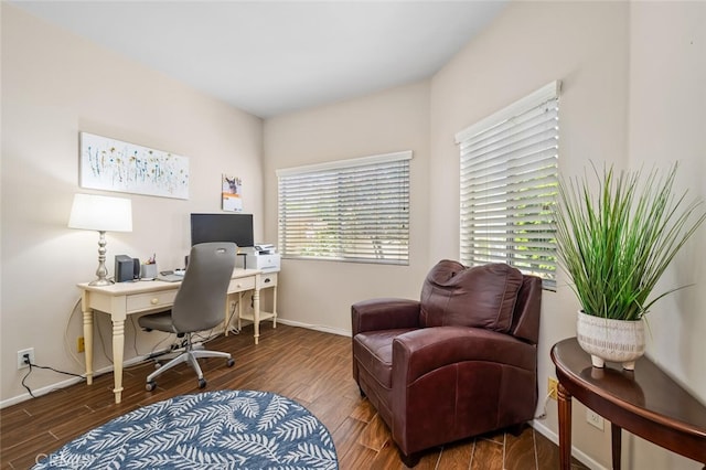 home office with baseboards and wood finished floors
