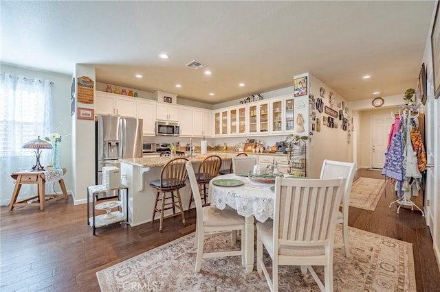 718 Marybelle Dr, Merced, CA 95348 - dining area with visible vents, recessed lighting, and dark wood-type flooring