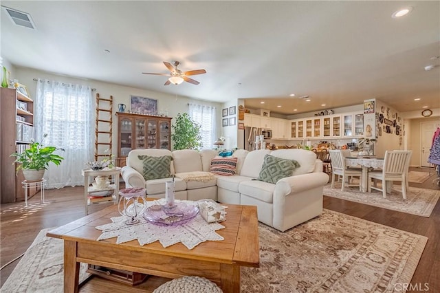 718 Marybelle Dr, Merced, CA 95348 - living area featuring recessed lighting, wood finished floors, visible vents, and a ceiling fan