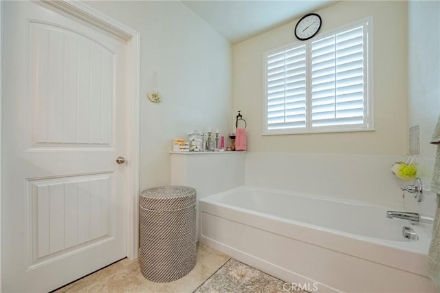 718 Marybelle Dr, Merced, CA 95348 - full bathroom with a bath and tile patterned floors