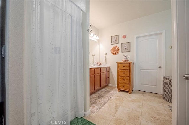 718 Marybelle Dr, Merced, CA 95348 - bathroom with tile patterned floors and vanity