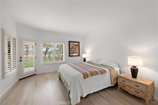 20 Marseille, Laguna Niguel, CA 92677 - bedroom featuring baseboards, wood finished floors, and access to outside
