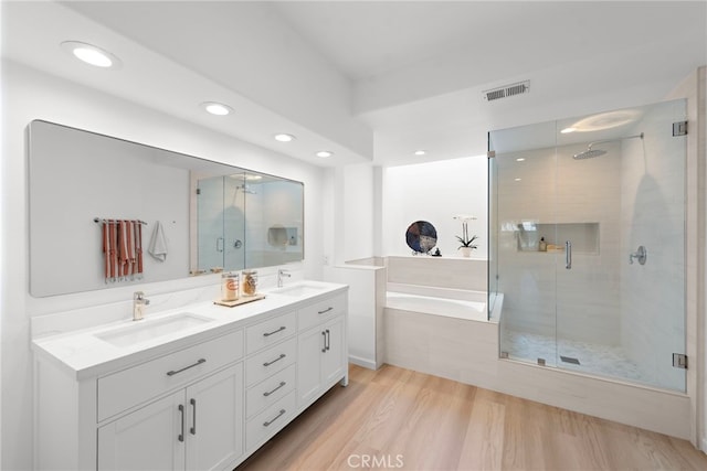 20 Marseille, Laguna Niguel, CA 92677 - bathroom featuring recessed lighting, a shower stall, visible vents, a sink, and a bath