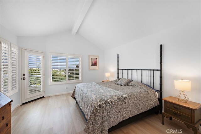 20 Marseille, Laguna Niguel, CA 92677 - bedroom with lofted ceiling with beams, baseboards, access to exterior, and light wood-style flooring
