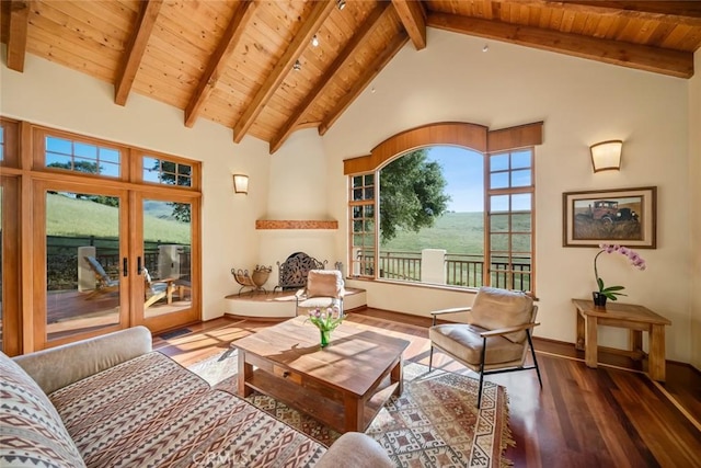 living area featuring wood ceiling, wood finished floors, and beam ceiling