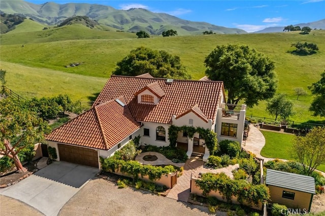 birds eye view of property with a rural view and a mountain view