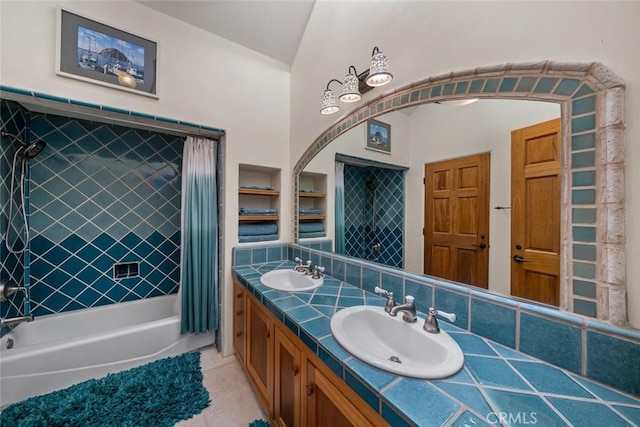 full bathroom featuring shower / bath combination with curtain, tile patterned floors, a sink, and double vanity