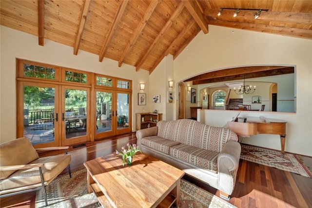 living area featuring arched walkways, wood finished floors, wooden ceiling, and an inviting chandelier