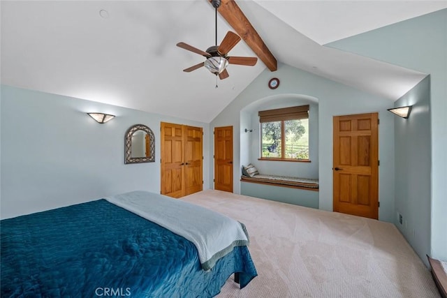 bedroom featuring lofted ceiling with beams, a ceiling fan, and carpet floors