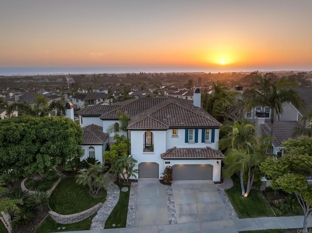 7076 Heron Cir, Carlsbad, CA 92011 - view of front of house with a tiled roof, driveway, a garage, stucco siding, and a chimney