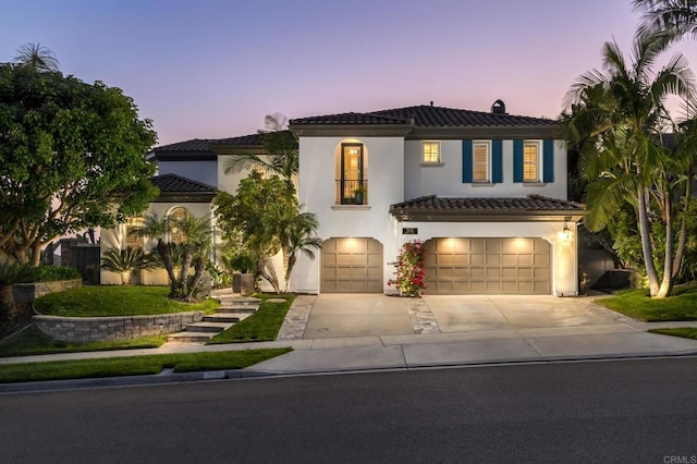 7076 Heron Cir, Carlsbad, CA 92011 - mediterranean / spanish-style home featuring a tile roof, a garage, driveway, and stucco siding