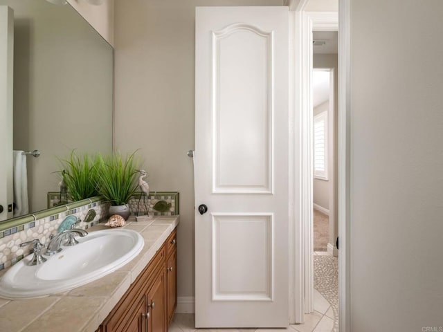 7076 Heron Cir, Carlsbad, CA 92011 - bathroom with vanity and baseboards