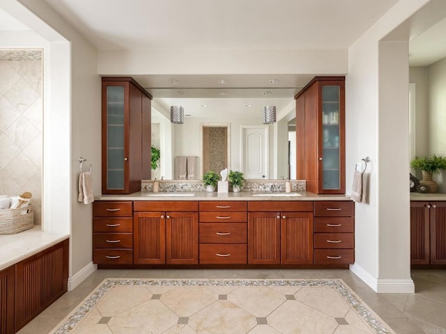 7076 Heron Cir, Carlsbad, CA 92011 - full bath featuring double vanity, baseboards, and inlaid floor details