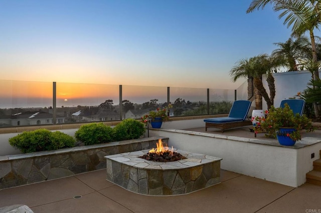 7076 Heron Cir, Carlsbad, CA 92011 - patio terrace at dusk featuring a fire pit and a patio area