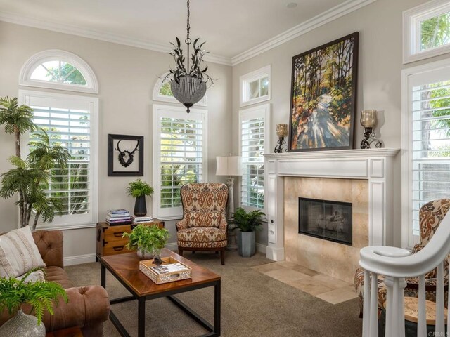 7076 Heron Cir, Carlsbad, CA 92011 - carpeted living area featuring ornamental molding, a tiled fireplace, and baseboards