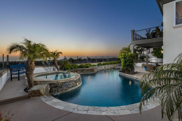 7076 Heron Cir, Carlsbad, CA 92011 - pool at dusk with a pool with connected hot tub and a patio area