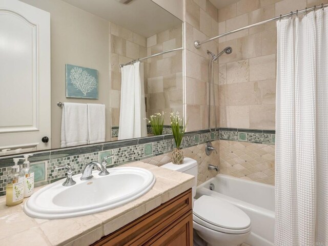 7076 Heron Cir, Carlsbad, CA 92011 - full bathroom featuring shower / bathtub combination with curtain, decorative backsplash, vanity, and toilet