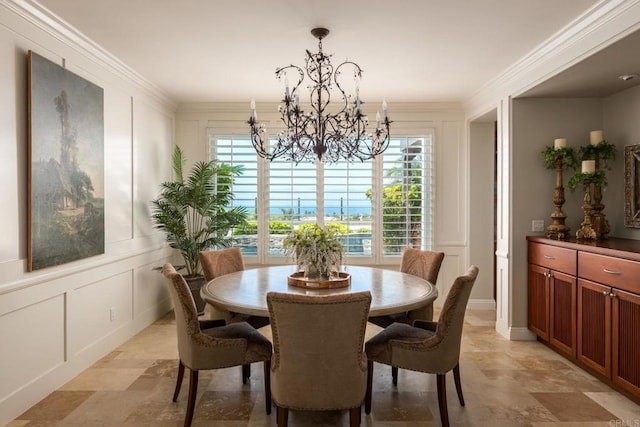 7076 Heron Cir, Carlsbad, CA 92011 - dining space with a chandelier, a decorative wall, stone finish flooring, and ornamental molding