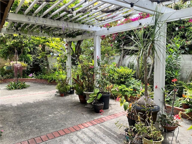 view of patio / terrace featuring fence and a pergola
