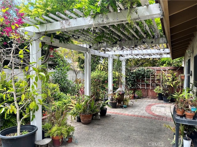 view of patio / terrace featuring a pergola and a fenced backyard
