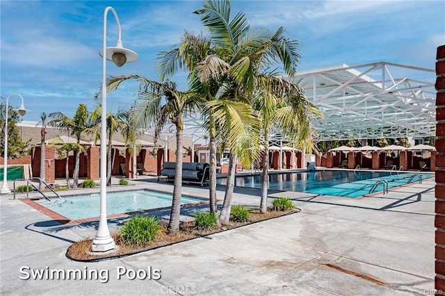 community pool with a patio area