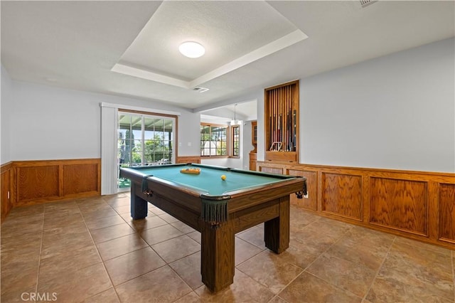 playroom featuring pool table, a wainscoted wall, a tray ceiling, wood walls, and visible vents