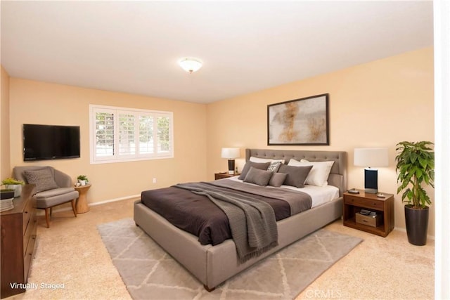 carpeted bedroom with baseboards