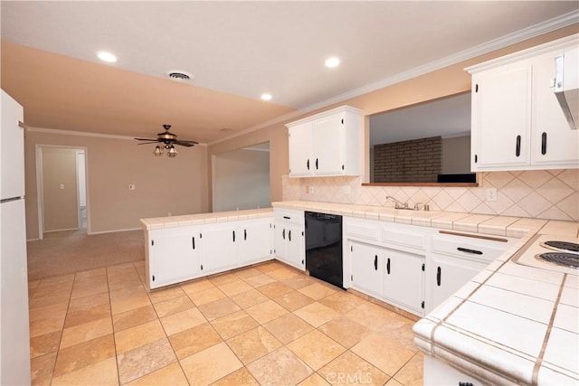 kitchen featuring a peninsula, backsplash, black dishwasher, tile countertops, and ornamental molding