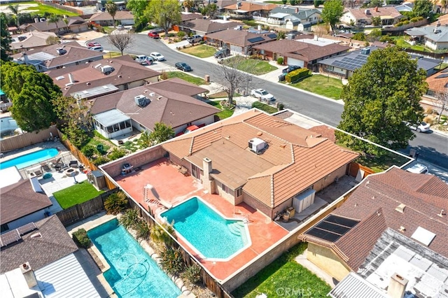 birds eye view of property with a residential view