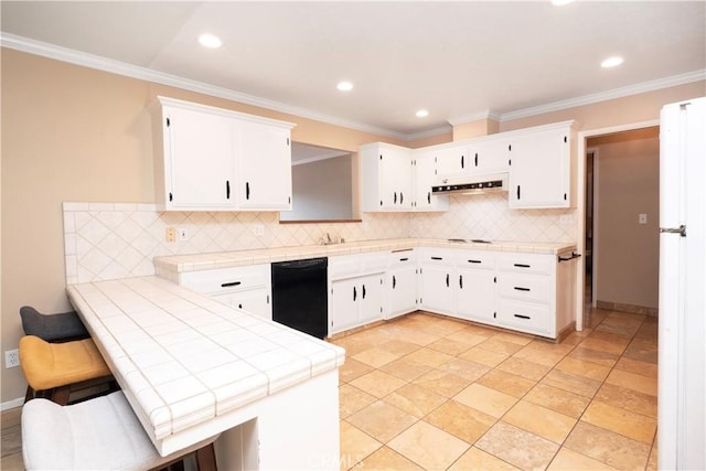 kitchen featuring dishwasher, backsplash, a peninsula, and tile countertops