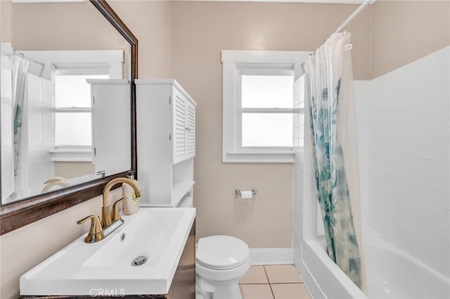 full bathroom with tile patterned floors, toilet, baseboards, shower / bath combo with shower curtain, and vanity