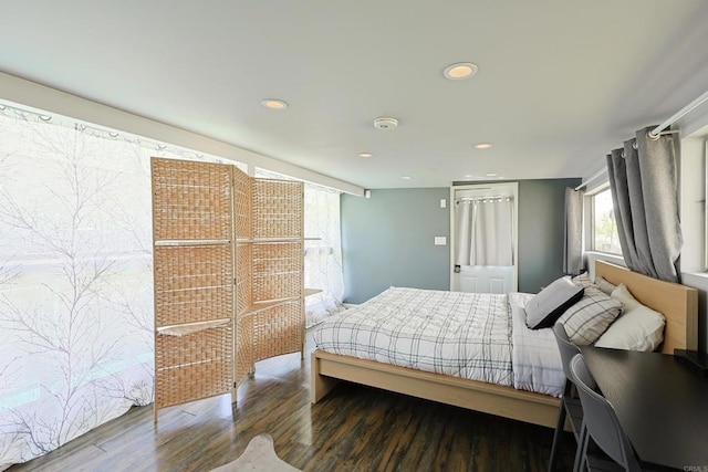 bedroom featuring recessed lighting and wood finished floors