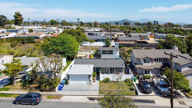 bird's eye view featuring a mountain view and a residential view