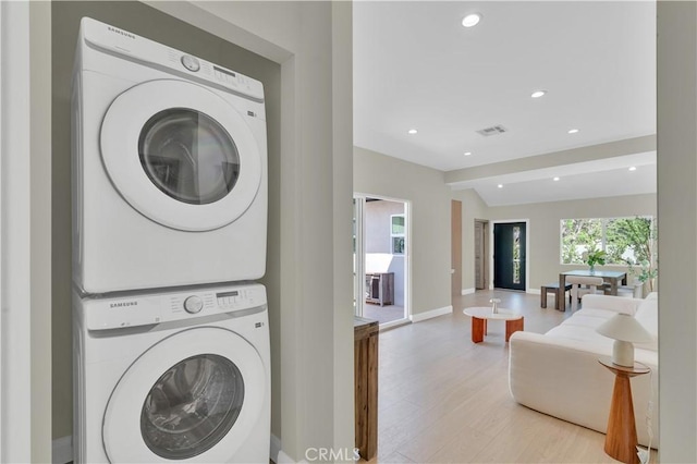 13301332 N Lincoln St, Burbank, CA 91506 - laundry room featuring stacked washer and dryer, visible vents, recessed lighting, light wood-style floors, and laundry area