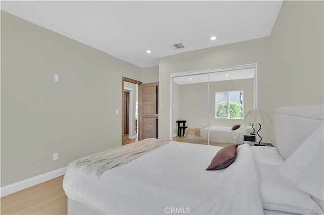 13301332 N Lincoln St, Burbank, CA 91506 - bedroom featuring recessed lighting, visible vents, light wood-style floors, a closet, and baseboards