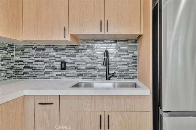 13301332 N Lincoln St, Burbank, CA 91506 - kitchen with a sink, tasteful backsplash, freestanding refrigerator, light brown cabinets, and light countertops