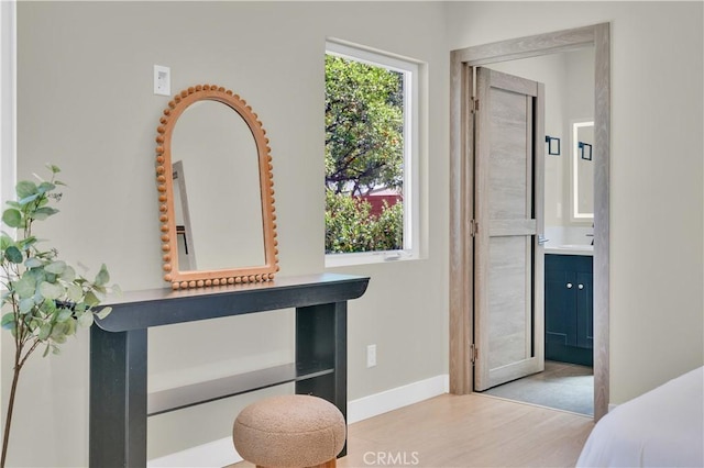 13301332 N Lincoln St, Burbank, CA 91506 - bedroom featuring baseboards, ensuite bathroom, and wood finished floors