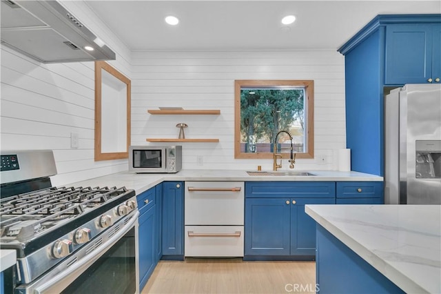 13301332 N Lincoln St, Burbank, CA 91506 - kitchen featuring blue cabinets, stainless steel appliances, light wood-style flooring, a sink, and premium range hood