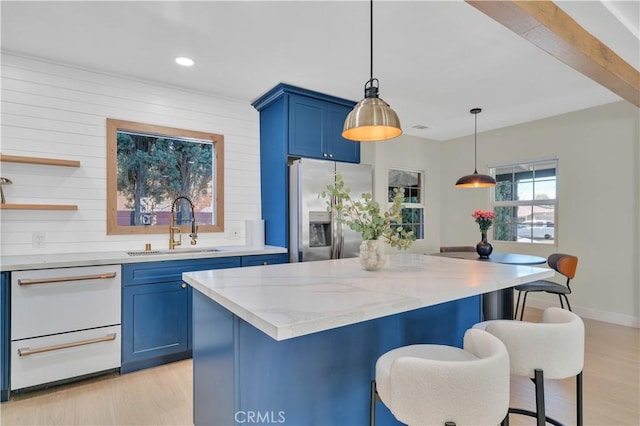 13301332 N Lincoln St, Burbank, CA 91506 - kitchen with a kitchen breakfast bar, a sink, stainless steel fridge, light wood-style flooring, and blue cabinetry