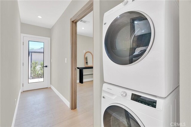 13301332 N Lincoln St, Burbank, CA 91506 - clothes washing area with stacked washer and dryer, baseboards, visible vents, and laundry area
