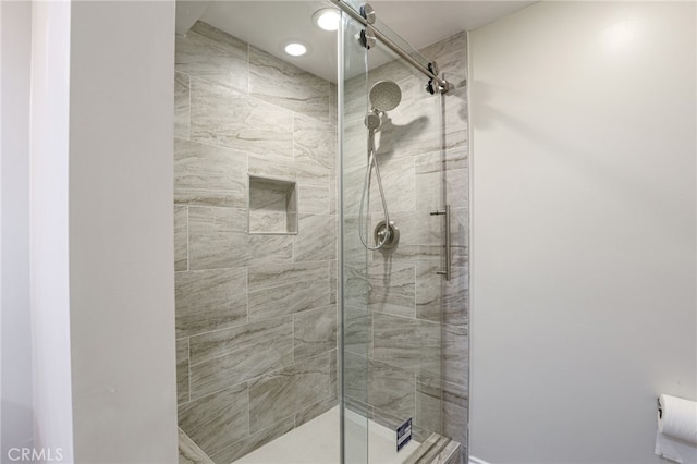 full bath with a shower stall
