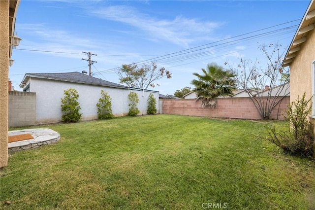view of yard with a fenced backyard