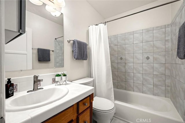 full bathroom with shower / bath combination with curtain, toilet, and vanity