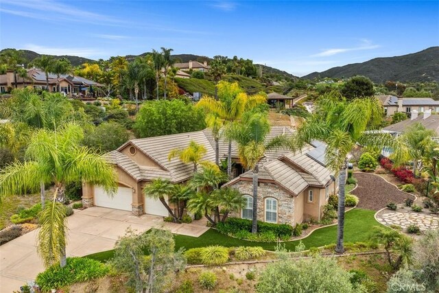 birds eye view of property featuring a mountain view