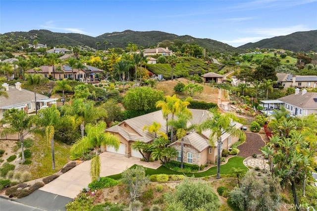 drone / aerial view with a mountain view and a residential view