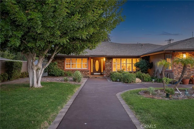 130 Mariposa Way, Brea, CA 92823 - view of front of property with roof with shingles, a front lawn, and stucco siding